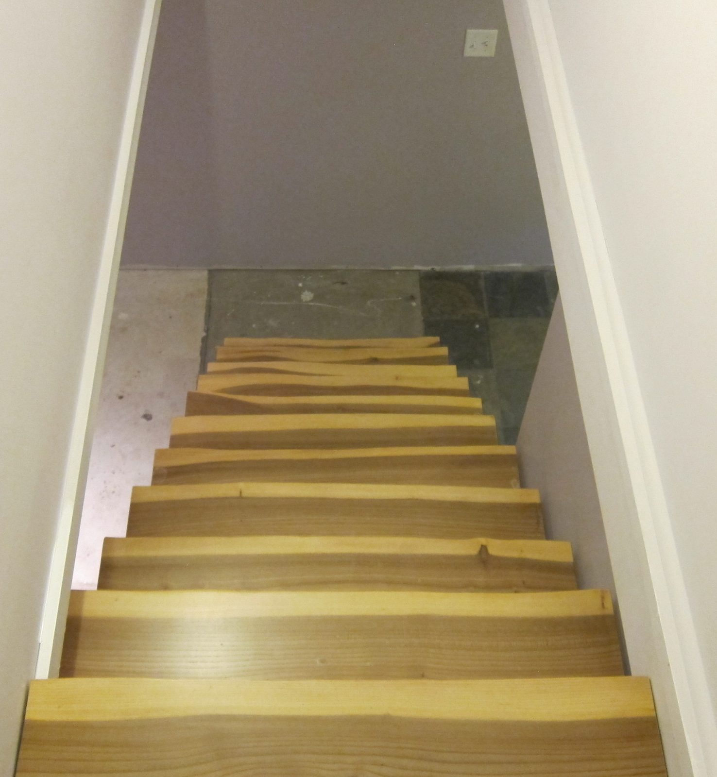 Live-edge elm stair treads installed on a staircase