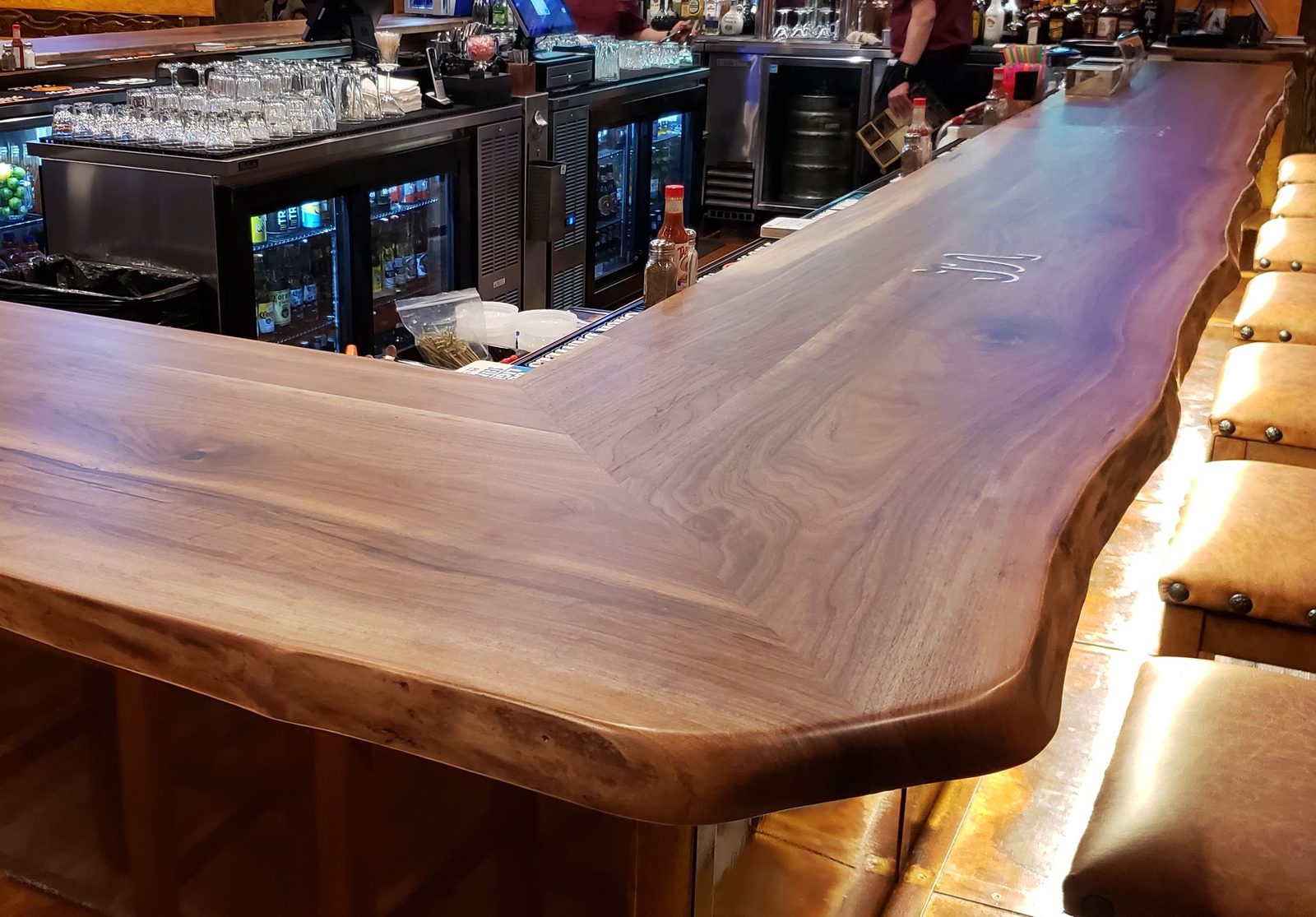 Black walnut live-edge bar top in a restaurant